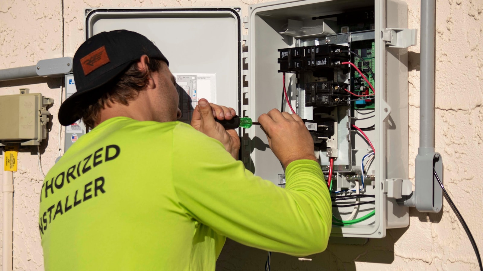 Electrician wiring a residential switchboard
